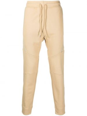Bavlněné sportovní kalhoty na zip C.p. Company béžové