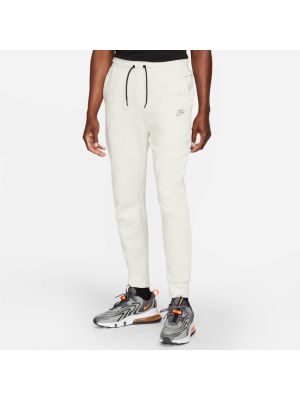 Fleecové teplákové nohavice Nike biela