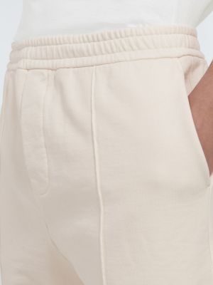 Bavlněné sportovní kalhoty Prada béžové