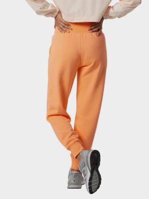 Спортивні брюки New Balance, помаранчеві
