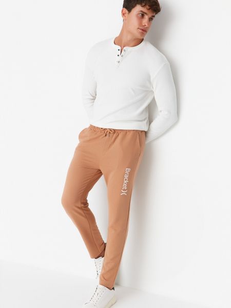 Bavlněné sportovní kalhoty s potiskem Trendyol