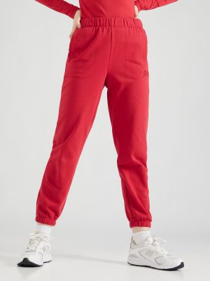 Teplákové nohavice Gap červená