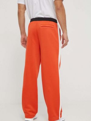 Sportovní kalhoty Puma oranžové