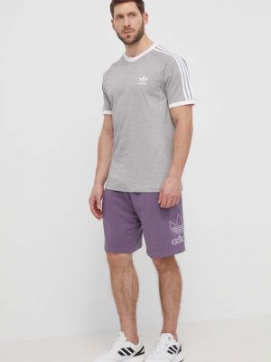 Bombažne hlače Adidas Originals vijolična