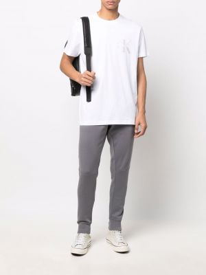 Dryžuotos sportinės kelnes Calvin Klein Jeans pilka