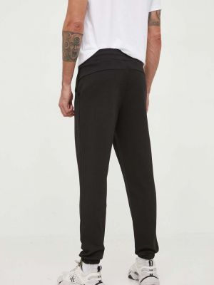 Sportovní kalhoty s aplikacemi Calvin Klein