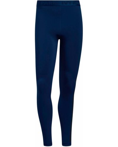 Spodnie ze stretchu Adidas X Ivy Park - niebieski