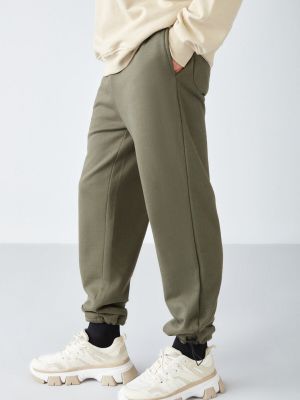 Voľné teplákové nohavice Grimelange khaki