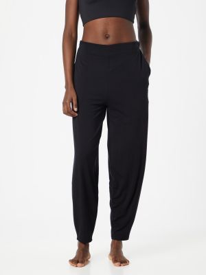 Teplákové nohavice Curare Yogawear čierna
