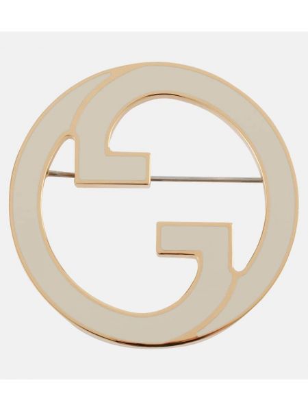 Broche Gucci guld