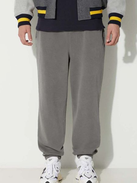 Bavlněné sportovní kalhoty Lacoste šedé