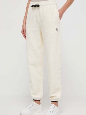 Béžové bavlněné sportovní kalhoty Tommy Hilfiger