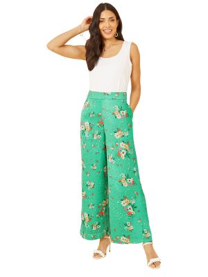 Атласные брюки в цветочек с принтом Yumi зеленые