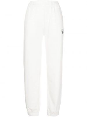 Bavlněné sportovní kalhoty s potiskem Lacoste bílé