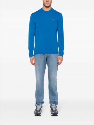 Haftowany sweter wełniany Lacoste niebieski