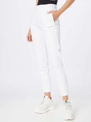 Priliehavé teplákové nohavice Calvin Klein biela
