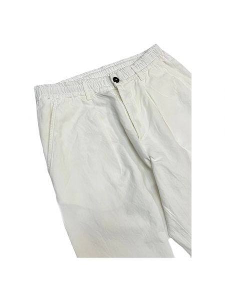 Pantalones rectos plisados Universal Works beige