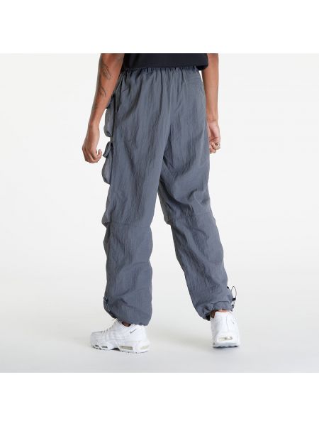 Pletené kalhoty se síťovinou Nike šedé