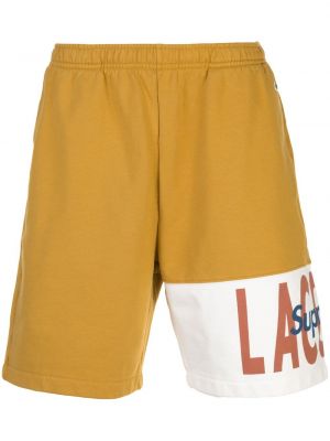 Pantalones cortos deportivos Supreme dorado