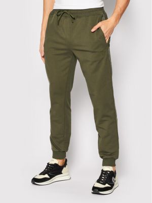 Priliehavé teplákové nohavice Guess zelená