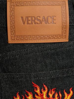 Kitsa lõikega teksapüksid Versace must