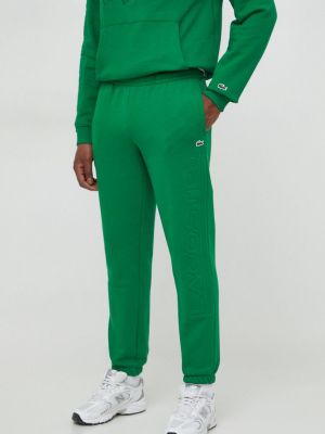 Спортивные штаны с аппликацией Lacoste зеленые