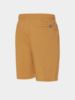 Оранжевые хлопковые спортивные шорты New Balance