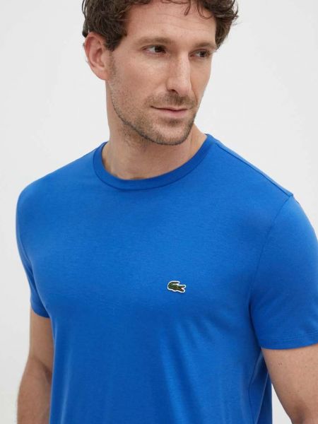 Koszulka bawełniana w jednolitym kolorze z krótkim rękawem Lacoste niebieska