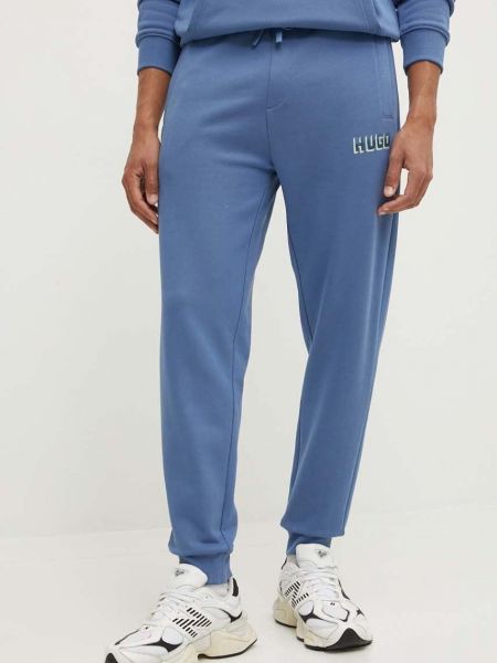 Spodnie sportowe bawełniane z nadrukiem Hugo niebieskie