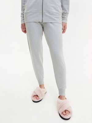 Teplákové nohavice Calvin Klein sivá