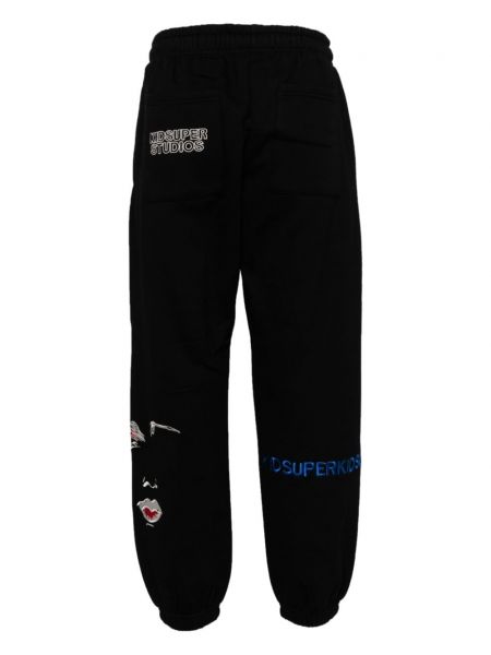 Sportovní kalhoty s výšivkou Kidsuper černé