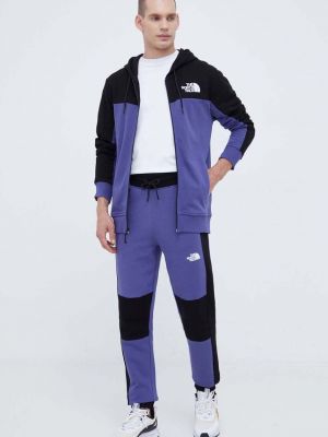 Spodnie sportowe bawełniane The North Face fioletowe