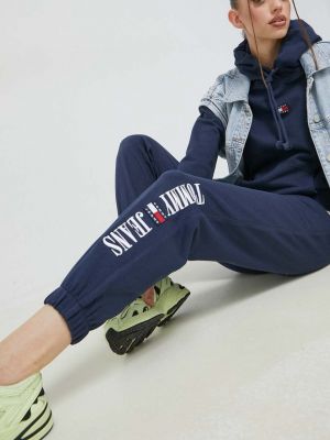 Sportovní kalhoty s potiskem Tommy Jeans bílé