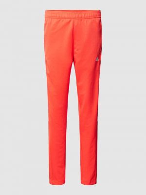 Spodnie sportowe z nadrukiem Adidas Sportswear czerwone