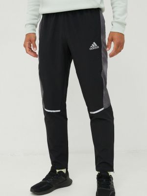 Sportovní kalhoty s potiskem Adidas Performance černé