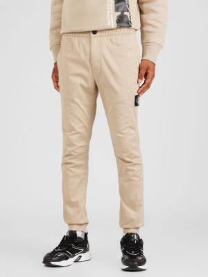 Bavlnené slim fit priliehavé nohavice Calvin Klein Jeans béžová