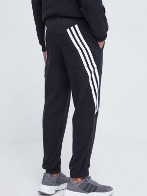 Sportovní kalhoty s potiskem Adidas černé