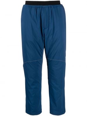 Spodnie sportowe z nadrukiem And Wander niebieskie