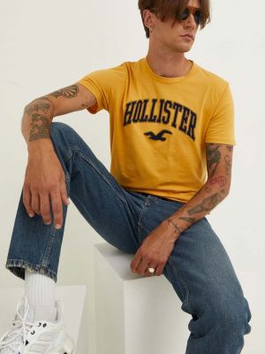 Bavlněné tričko s aplikacemi Hollister Co. žluté