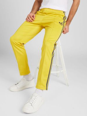 Teplákové nohavice Adidas Performance žltá