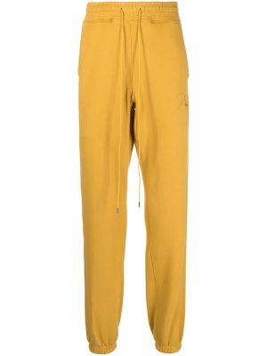 Bavlněné sportovní kalhoty s výšivkou Rhude - žlutá