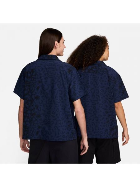 Пухова сорочка на ґудзиках з принтом Nike синя