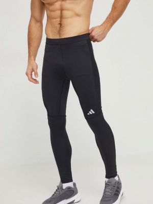 Běžecké kalhoty s potiskem Adidas Performance černé