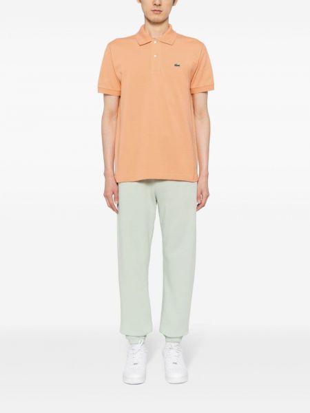 Dryžuotas medvilninis polo marškinėliai su aplikacija Lacoste oranžinė