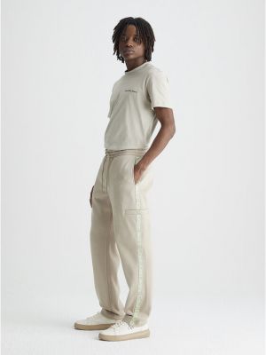 Αθλητικό παντελόνι Calvin Klein Jeans μπεζ