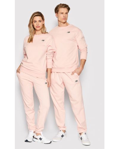 Laza szabású pulóver New Balance rózsaszín