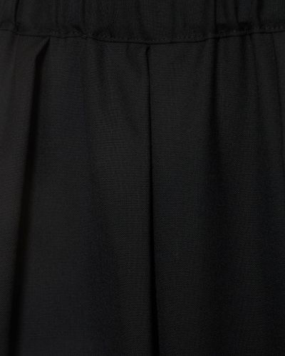Vlněné kalhoty relaxed fit Noir Kei Ninomiya černé