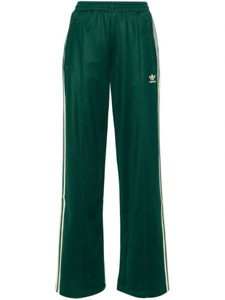 Voľné pruhované teplákové nohavice Adidas zelená
