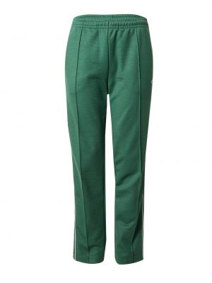 Зеленые брюки Lacoste