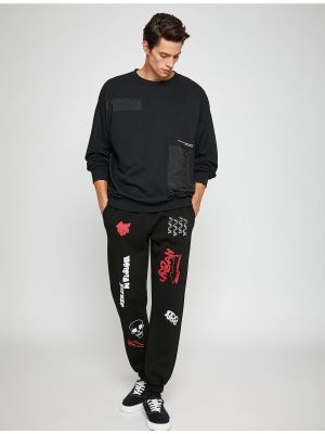 Šněrovací sportovní kalhoty s potiskem s kapsami Koton